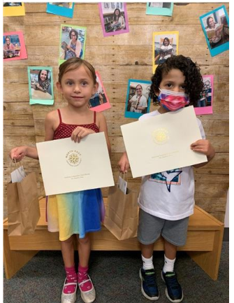  Boy and girl holding awards